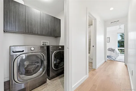 a view of a hallway with washer and dryer