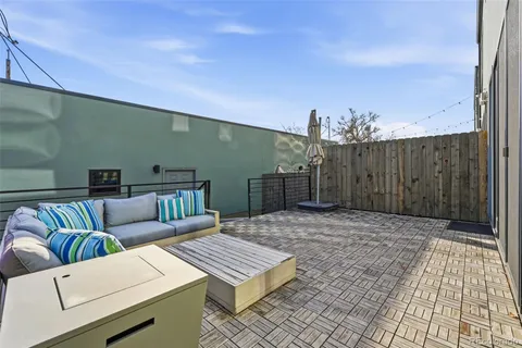 a view of a terrace with furniture