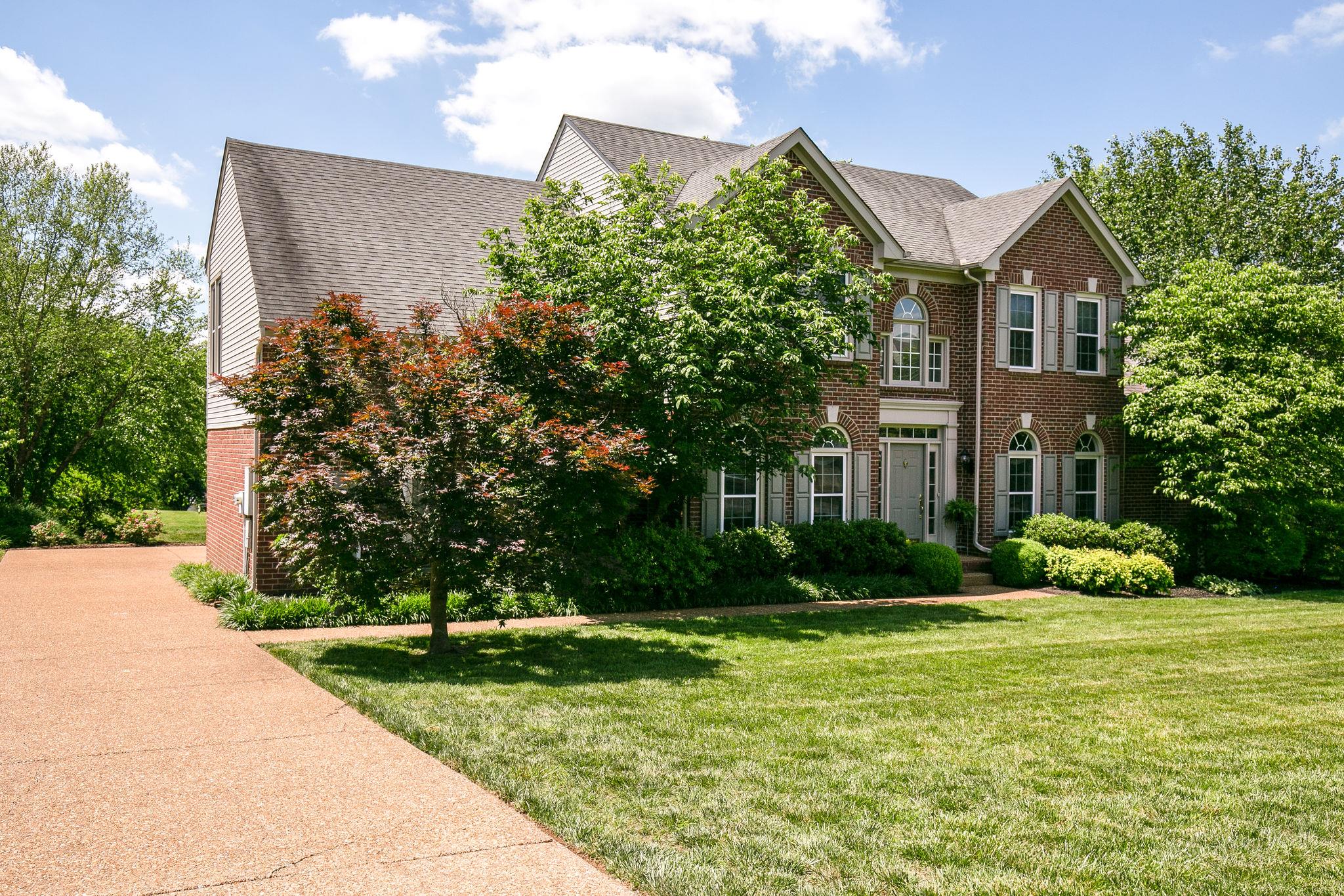 114 Chester Stevens Road Franklin, TN 37067 - Photo 2 of 30 a front view of a house with garden