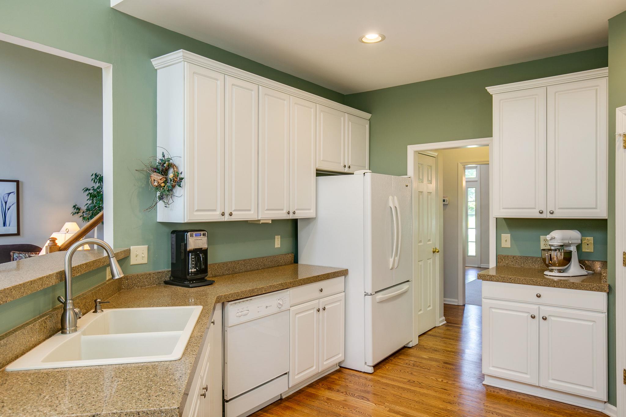 114 Chester Stevens Road Franklin, TN 37067 - Photo 12 of 30 a kitchen with white cabinets and refrigerator