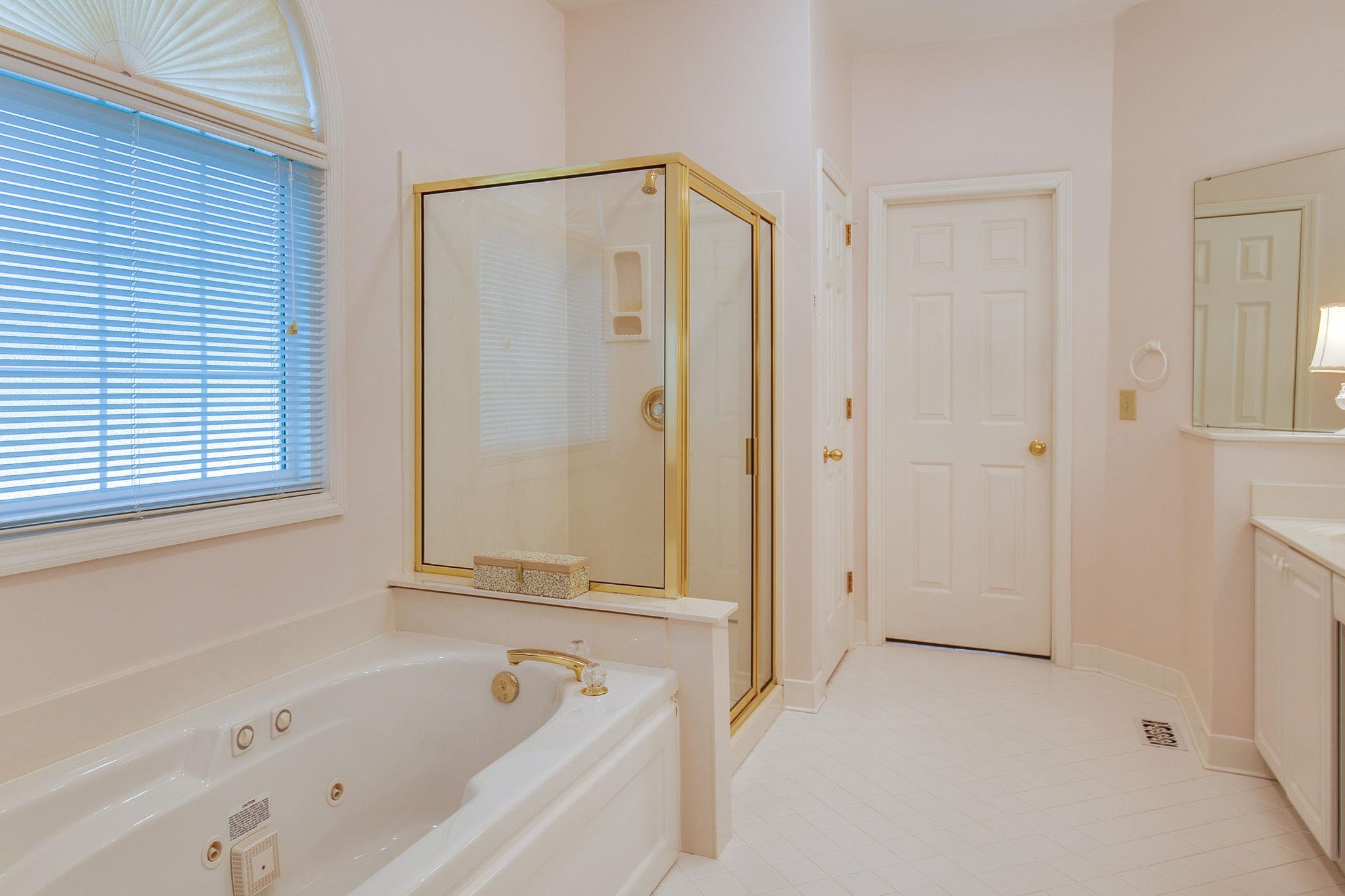 114 Chester Stevens Road Franklin, TN 37067 - Photo 19 of 30 a bathroom with a bathtub and a shower