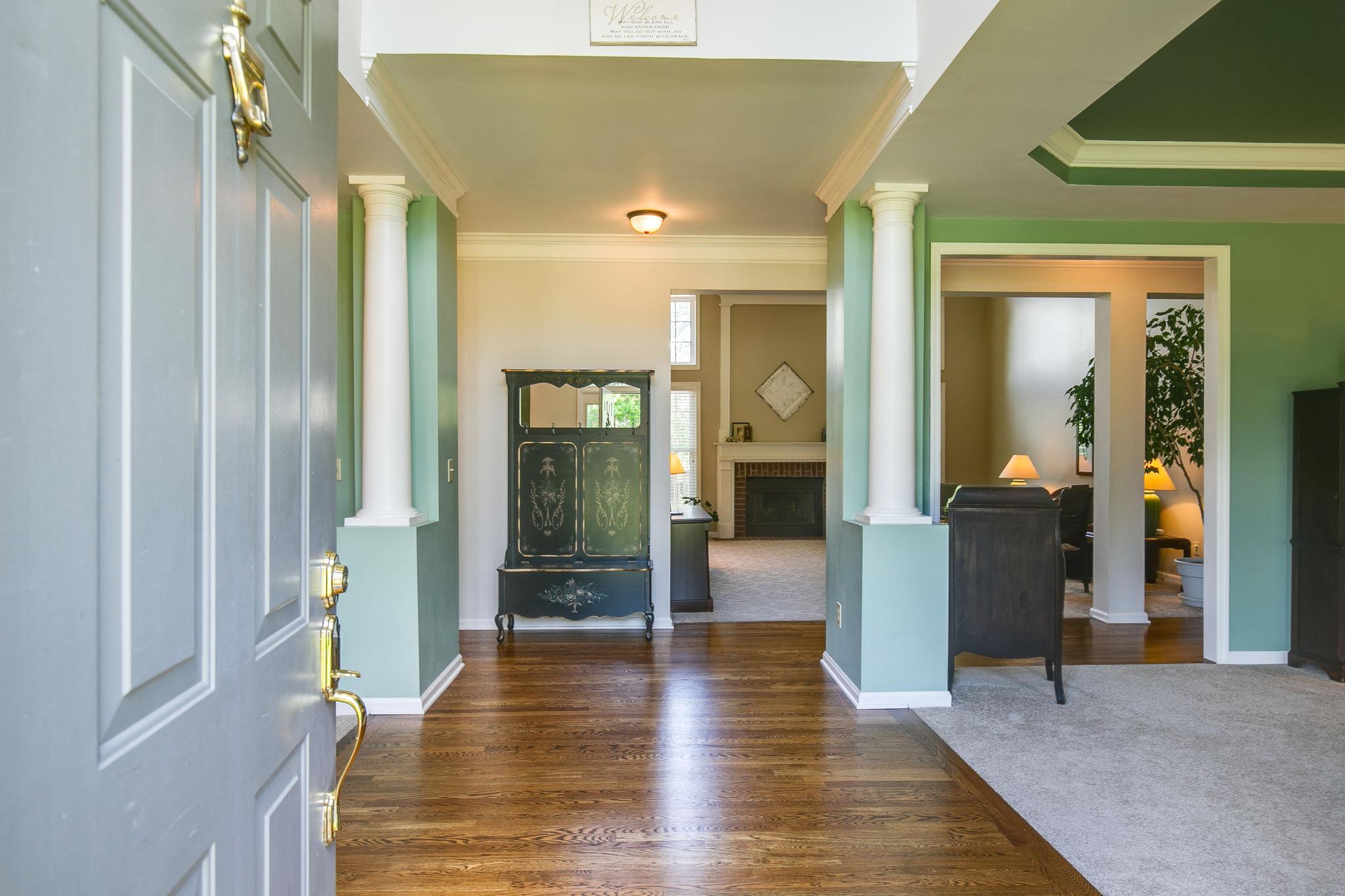 114 Chester Stevens Road Franklin, TN 37067 - Photo 3 of 30 a view of hallway with livingroom and wooden floor