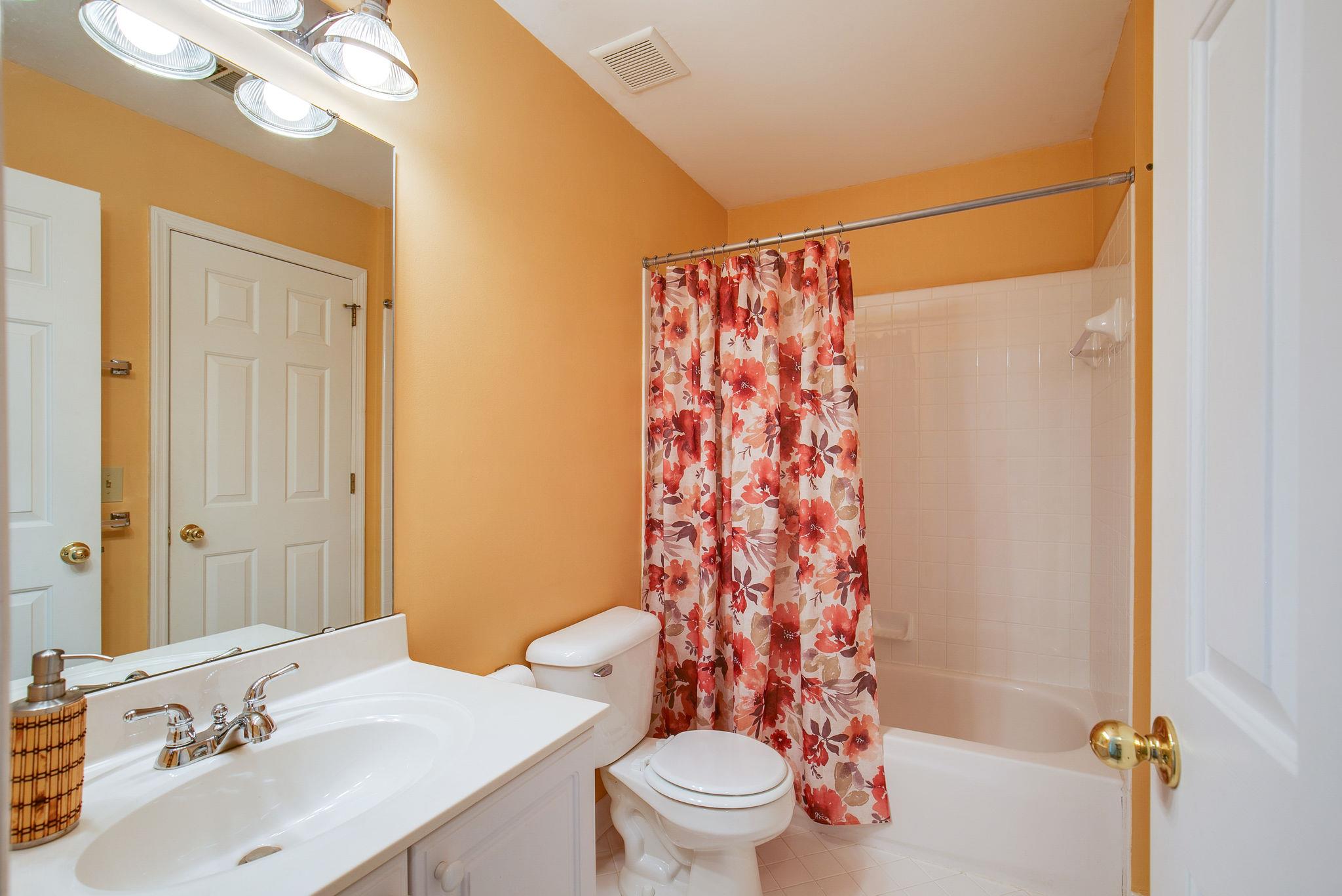 114 Chester Stevens Road Franklin, TN 37067 - Photo 22 of 30 a bathroom with a sink a toilet a mirror a vanity and shower