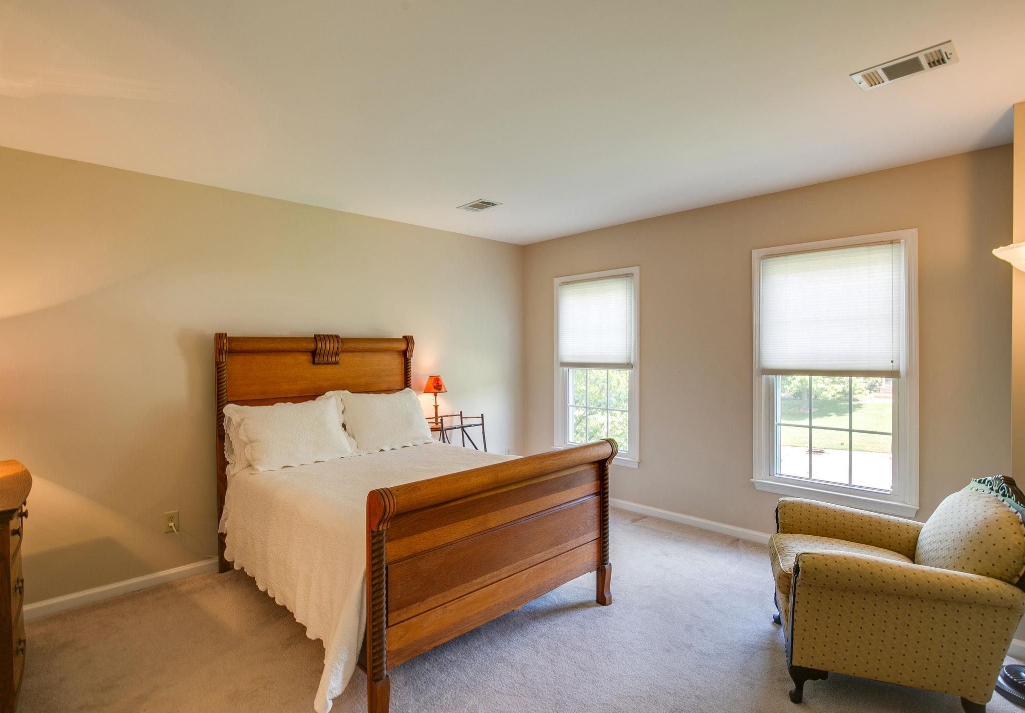 114 Chester Stevens Road Franklin, TN 37067 - Photo 23 of 30 a bedroom with bed couch and window