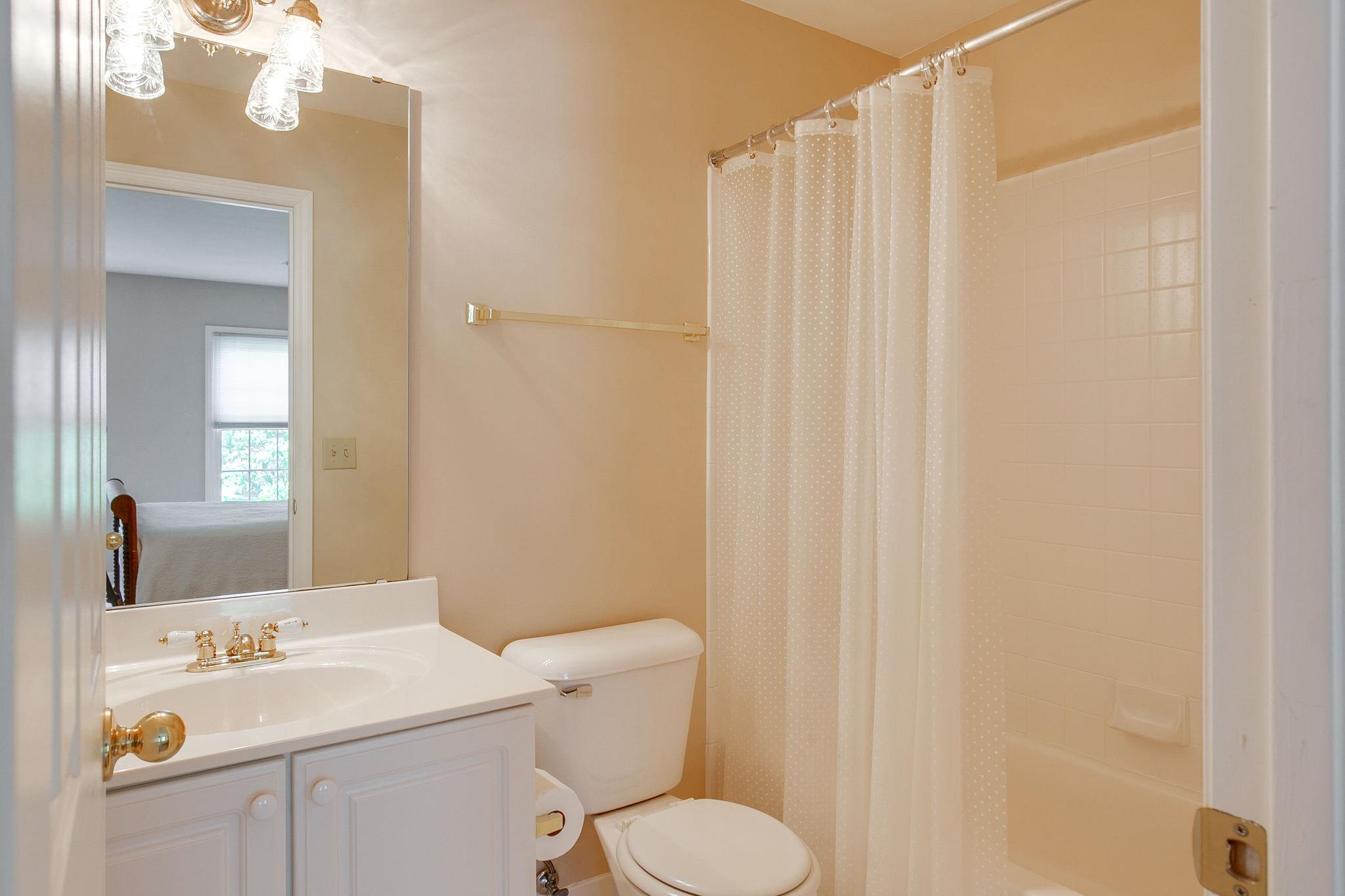 114 Chester Stevens Road Franklin, TN 37067 - Photo 24 of 30 a bathroom with a sink a toilet and shower curtain