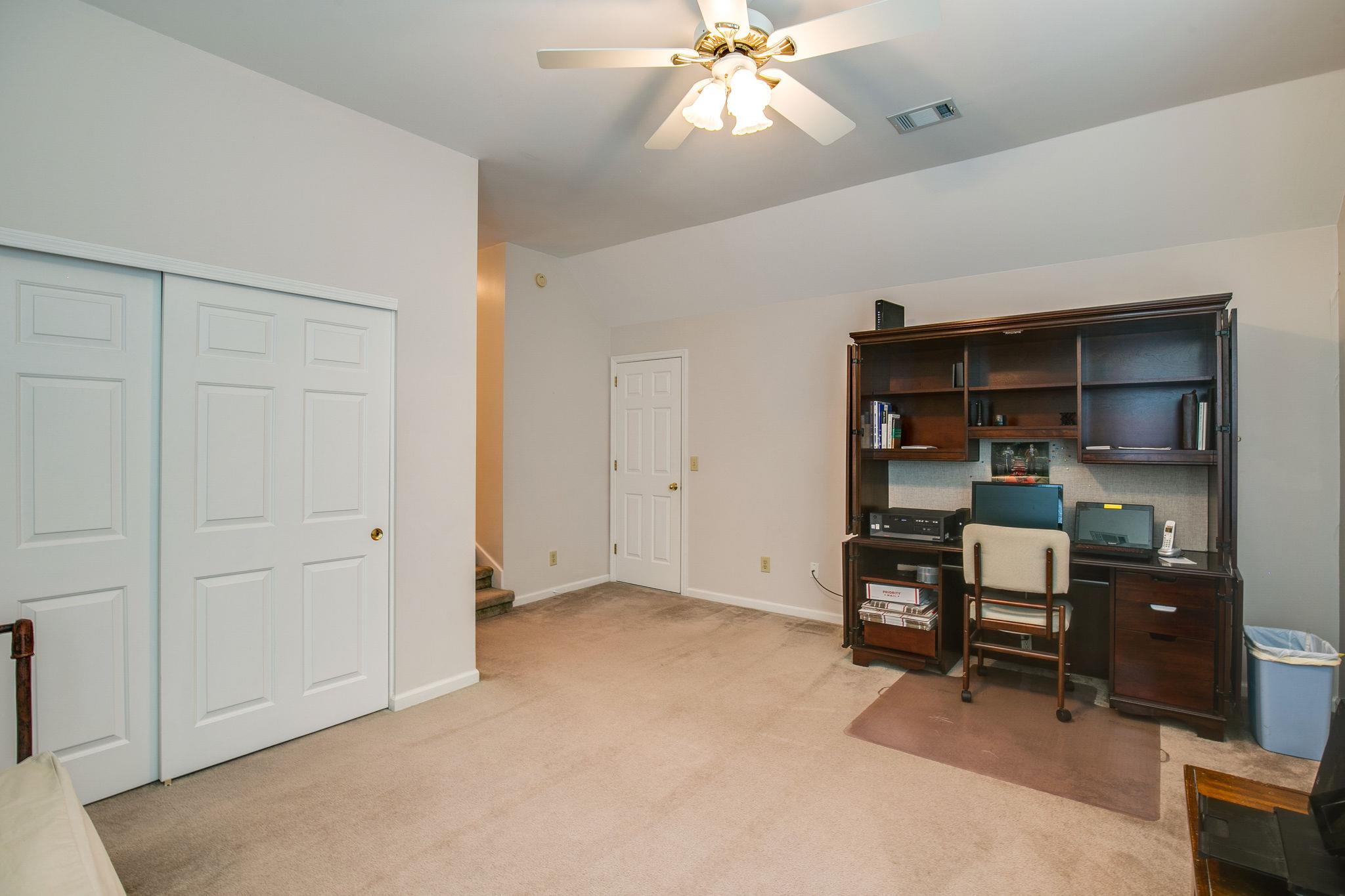 114 Chester Stevens Road Franklin, TN 37067 - Photo 26 of 30 a view of a bedroom with workspace and cabinet