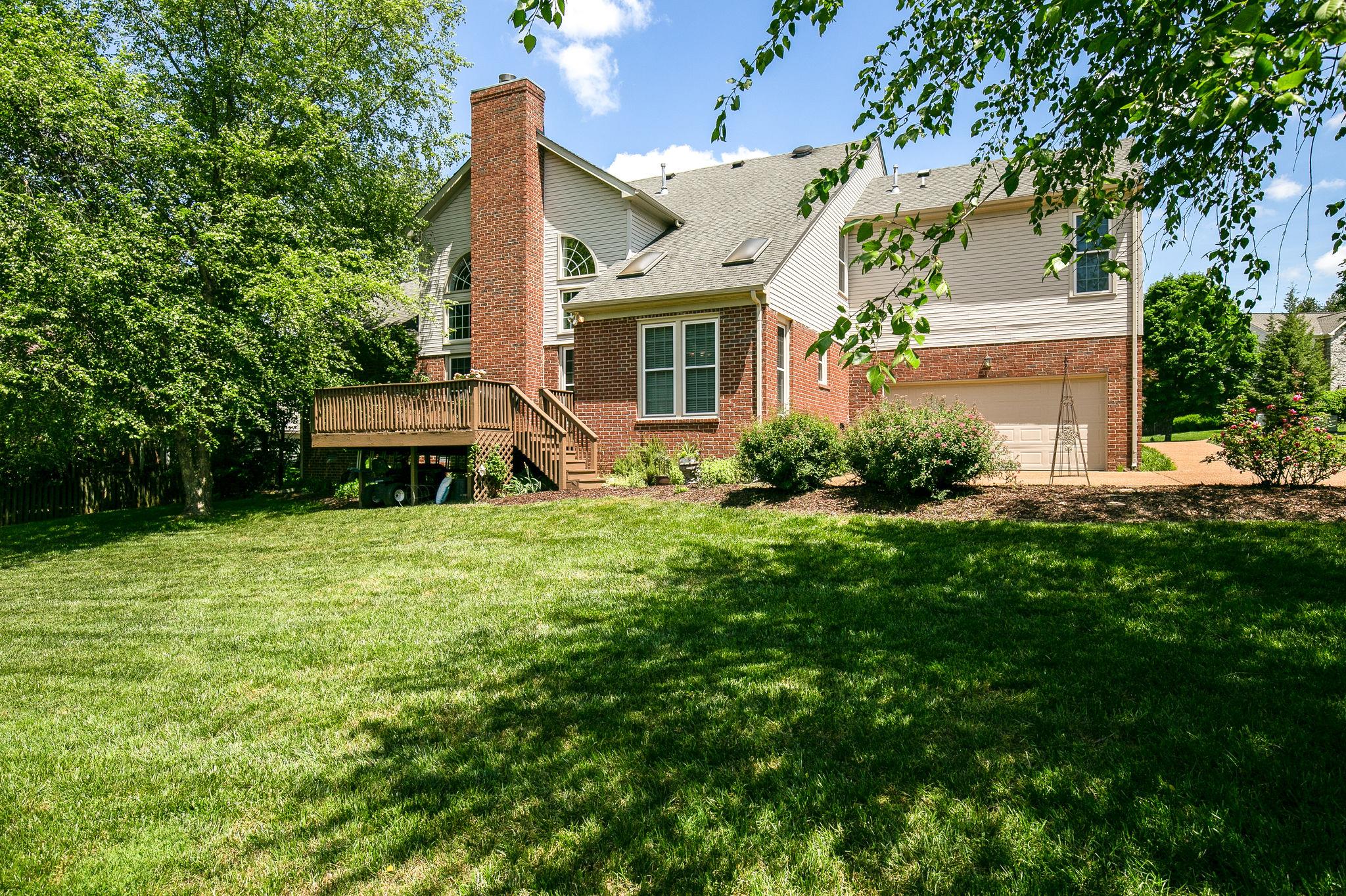 114 Chester Stevens Road Franklin, TN 37067 - Photo 28 of 30 a front view of a house with a yard and trees