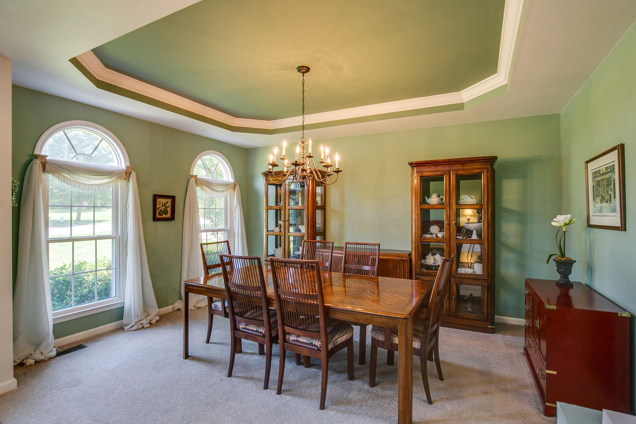 114 Chester Stevens Road Franklin, TN 37067 - Photo 6 of 30 a view of a dining room with furniture and a chandelier