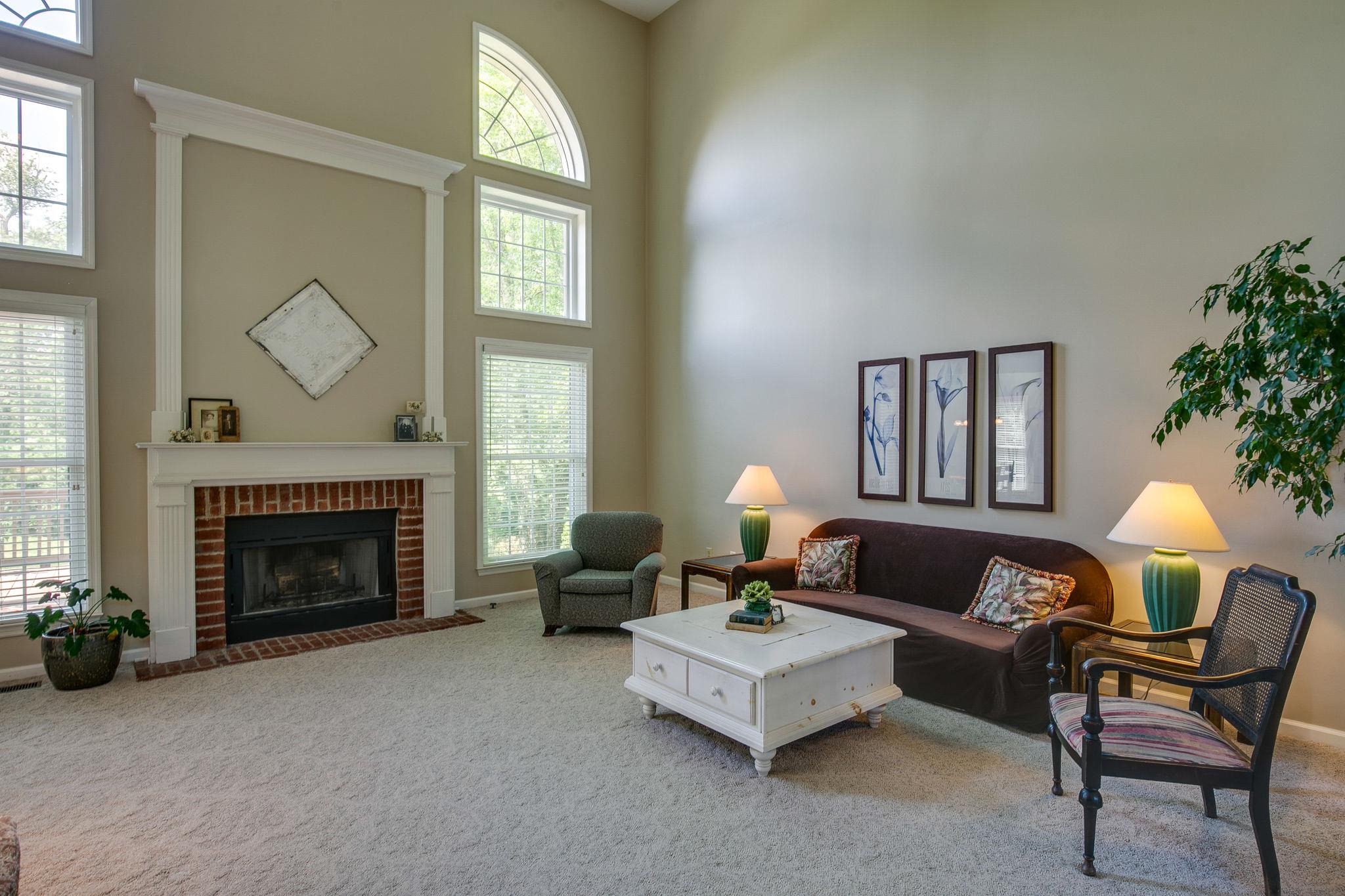 114 Chester Stevens Road Franklin, TN 37067 - Photo 8 of 30 a living room with furniture and a fireplace