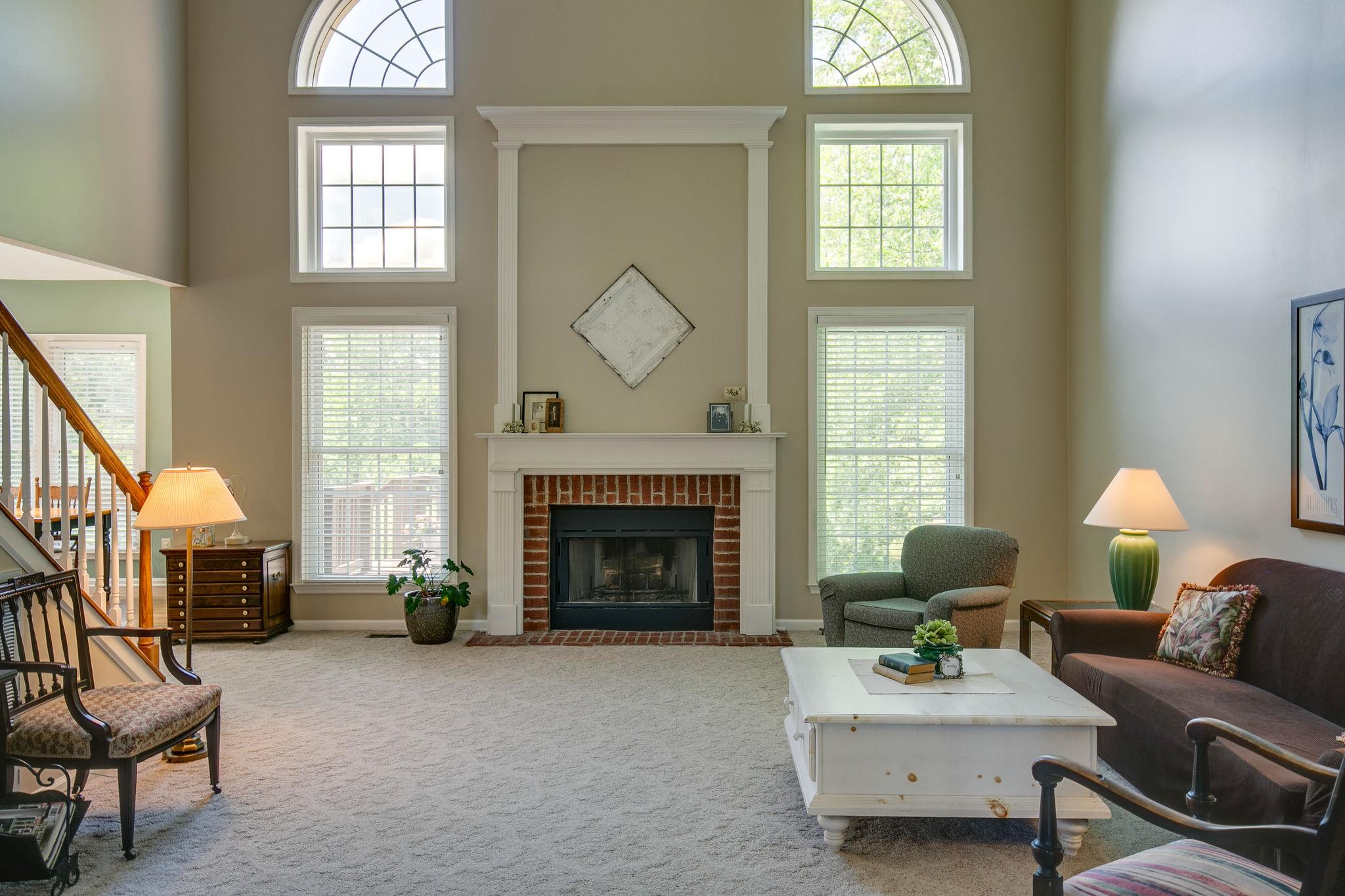114 Chester Stevens Road Franklin, TN 37067 - Photo 9 of 30 a living room with furniture and a fireplace