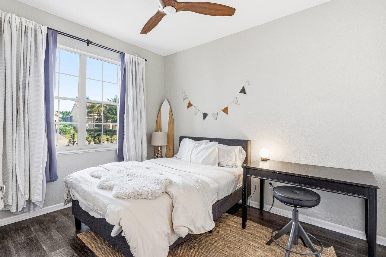 9507 Lake Serena Drive Boca Raton, FL 33496 - Photo 18 of 26 a bedroom with a bed and a window