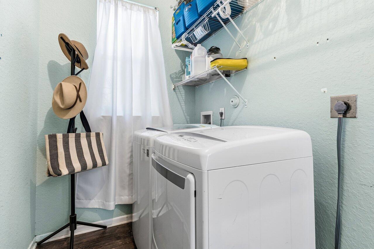 9507 Lake Serena Drive Boca Raton, FL 33496 - Photo 19 of 26 a utility room with dryer and washer