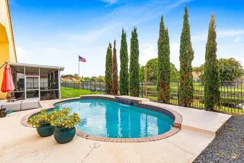 a view of a swimming pool with a lounge chair
