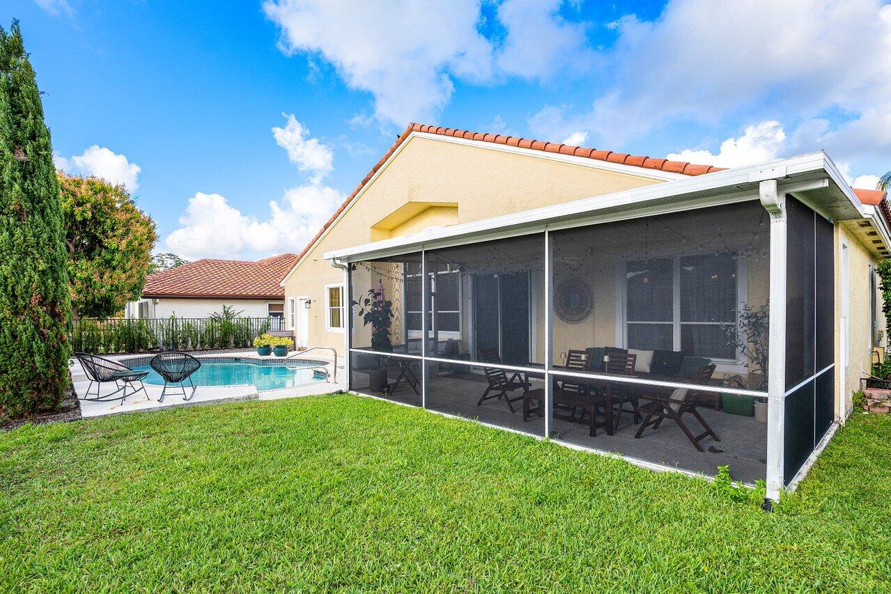 9507 Lake Serena Drive Boca Raton, FL 33496 - Photo 22 of 26 a view of an house with backyard space and sitting area
