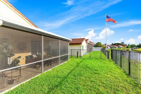 a view of a backyard with sitting area