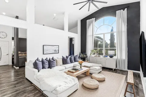 a living room with furniture and a table