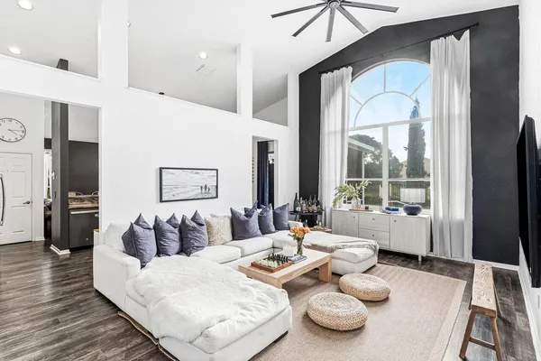 a living room with furniture and a table