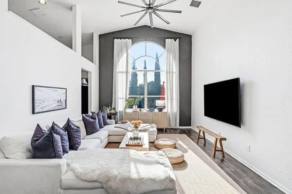 a living room with furniture fireplace and flat screen tv