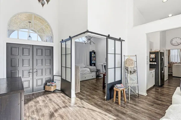 a view of an entryway with wooden floor