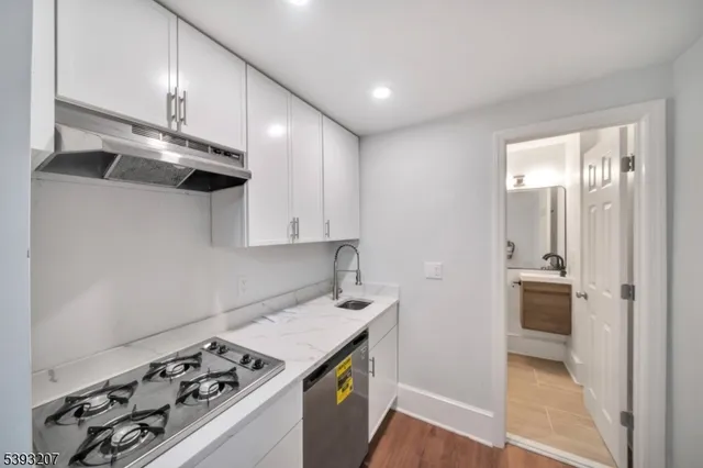 a kitchen with a stove and a refrigerator