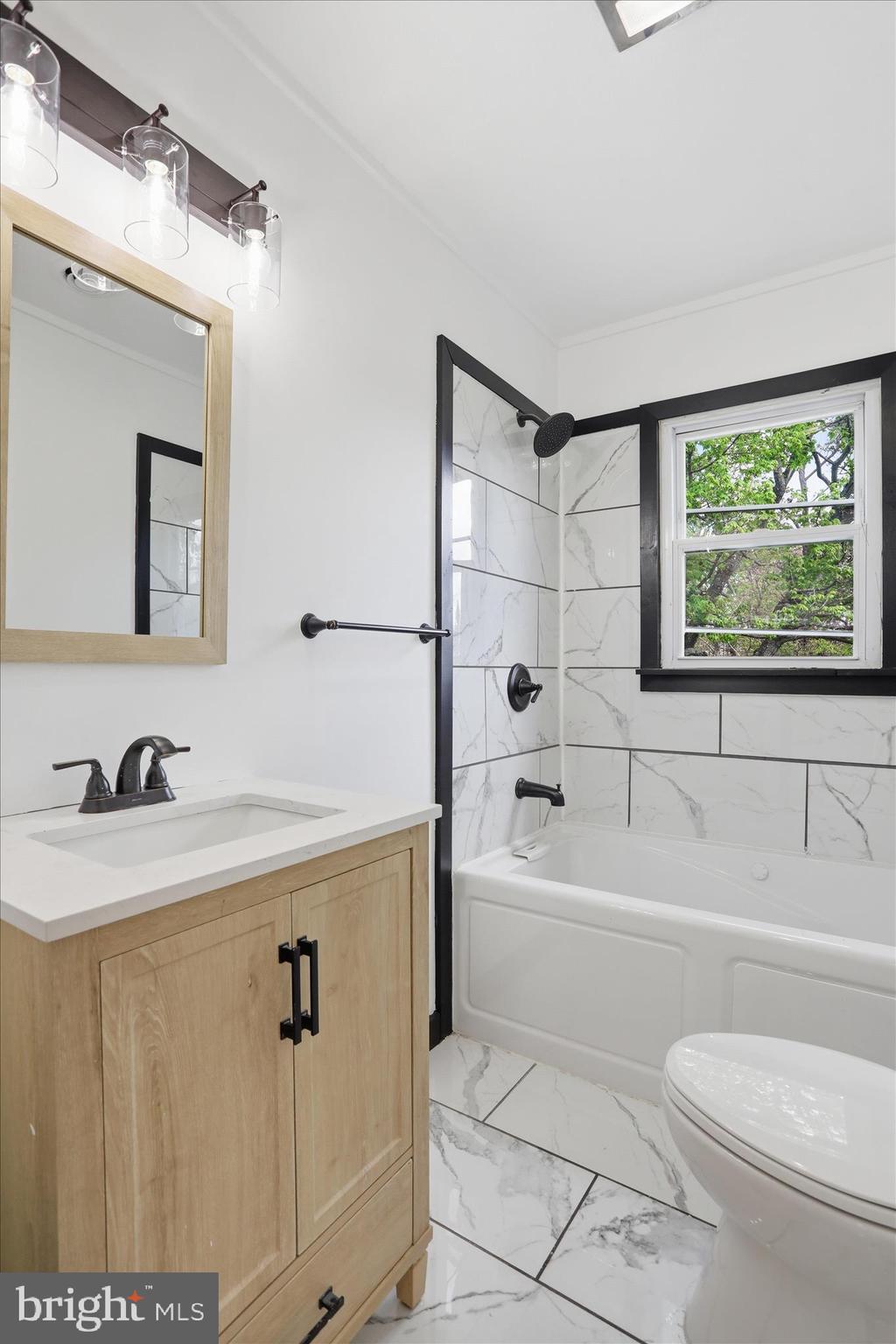 55 Highland Ridge Road Berkeley Springs, WV 25411 - Photo 14 of 44 a bathroom with a sink a toilet and a bathtub