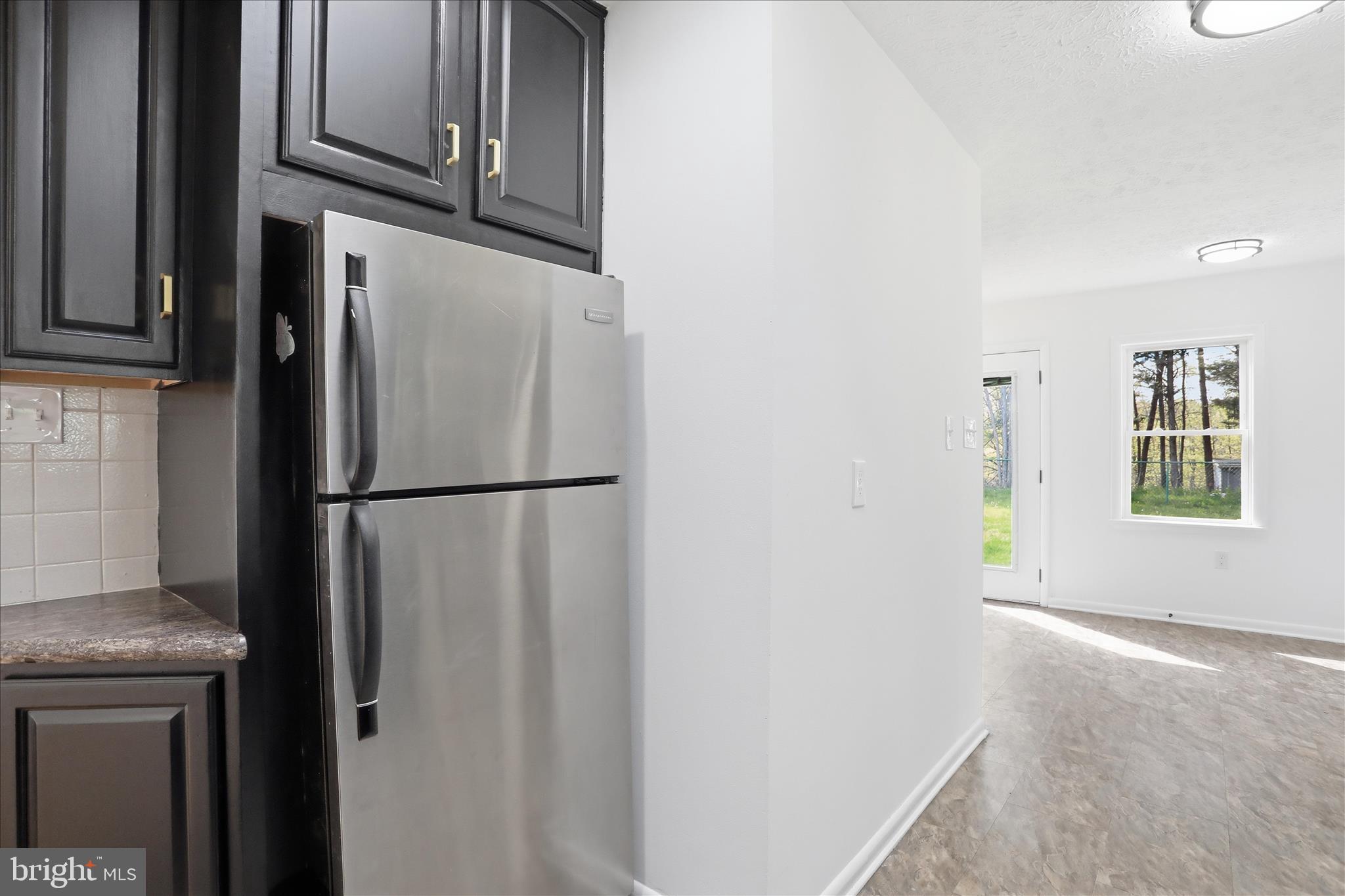 55 Highland Ridge Road Berkeley Springs, WV 25411 - Photo 19 of 44 a view of kitchen with furniture and refrigerator
