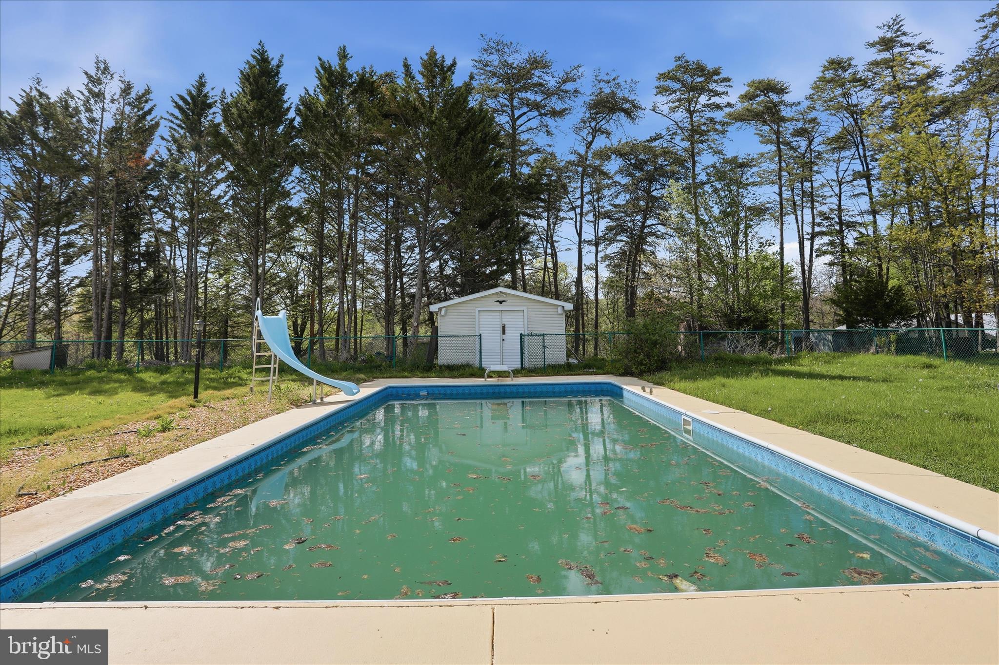 55 Highland Ridge Road Berkeley Springs, WV 25411 - Photo 2 of 44 a view of a swimming pool with a yard