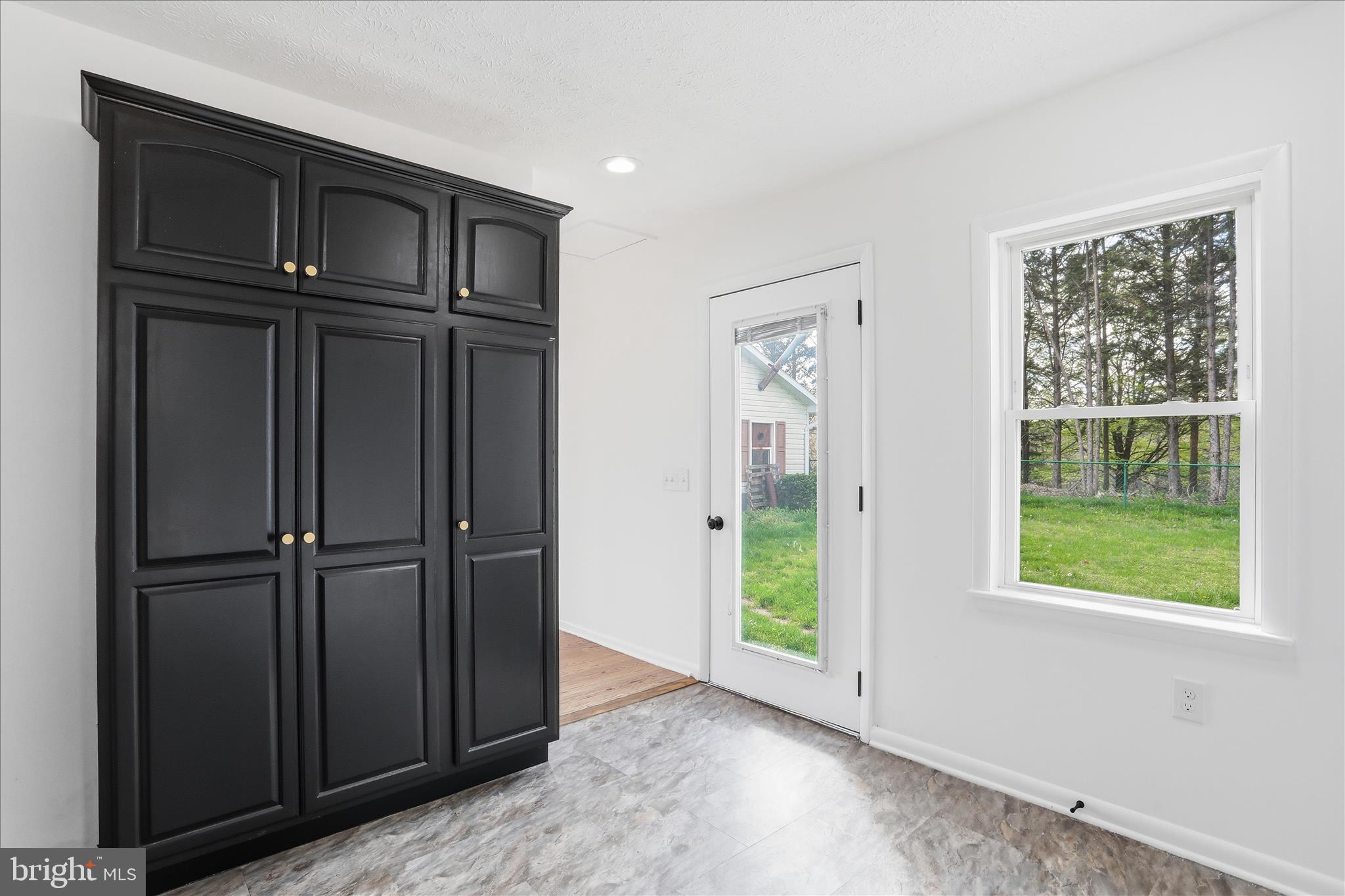 55 Highland Ridge Road Berkeley Springs, WV 25411 - Photo 22 of 44 an empty room with wooden door