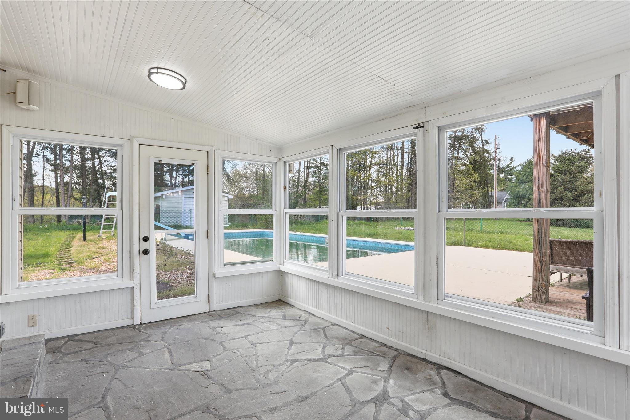 55 Highland Ridge Road Berkeley Springs, WV 25411 - Photo 27 of 44 a view of a large window with an outdoor space