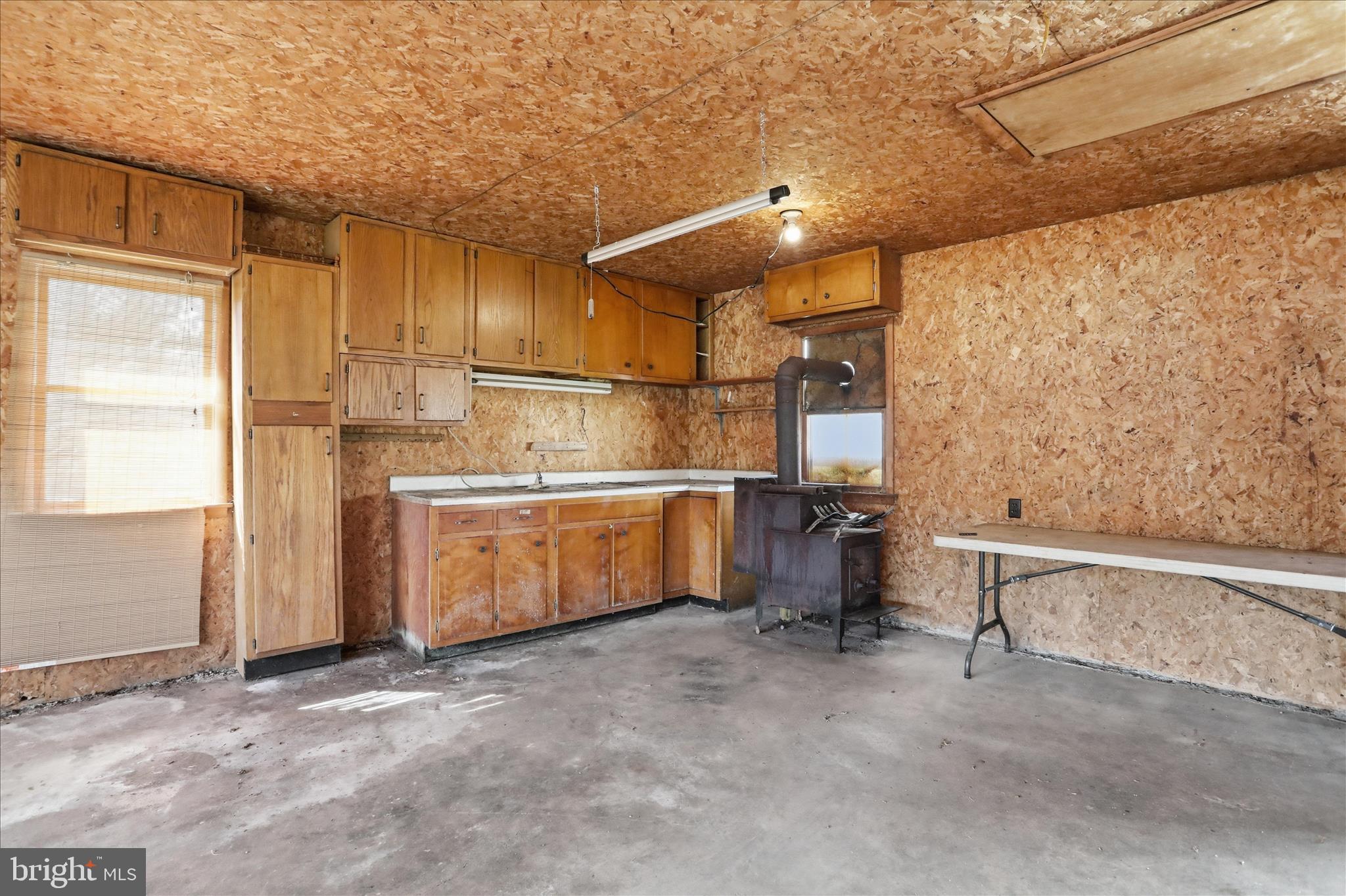 55 Highland Ridge Road Berkeley Springs, WV 25411 - Photo 41 of 44 a kitchen with refrigerator and window