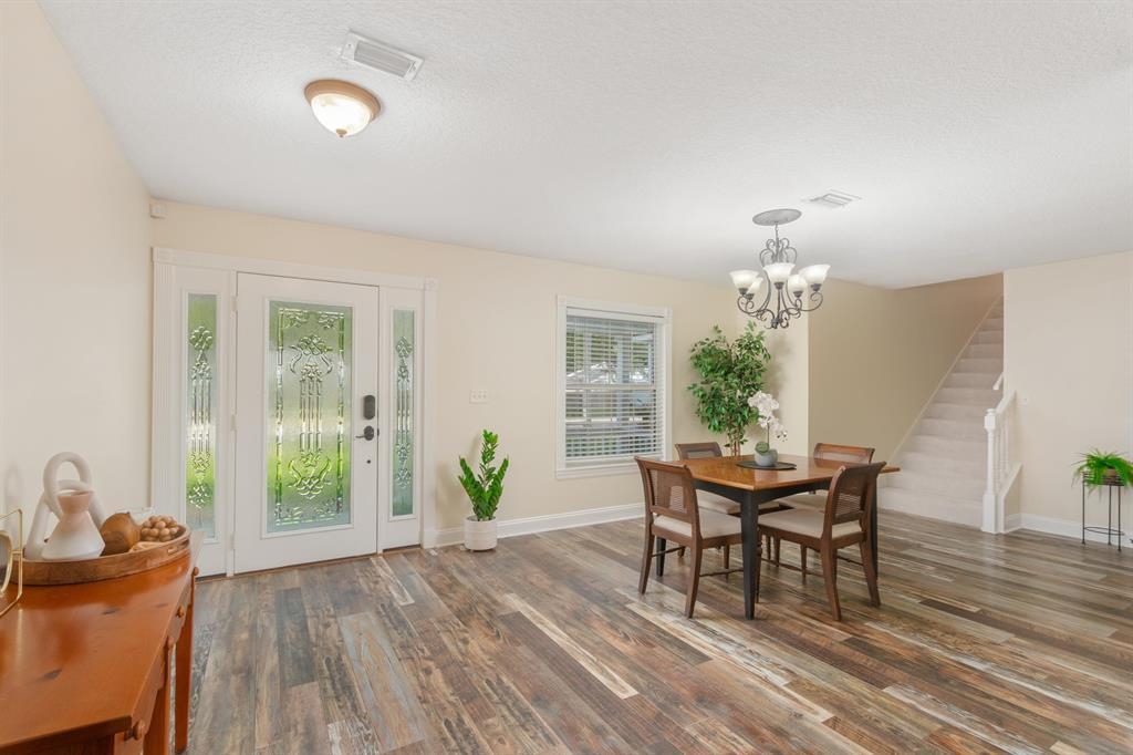 205 Shirley's Way St. Augustine, FL 32086 - Photo 17 of 56 a dining room with furniture a livingroom and chandelier