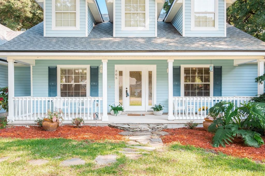 205 Shirley's Way St. Augustine, FL 32086 - Photo 3 of 56 a front view of a house with a yard