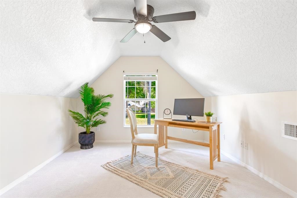 205 Shirley's Way St. Augustine, FL 32086 - Photo 32 of 56 a living room with furniture and a potted plant