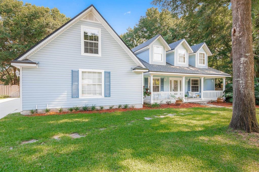 205 Shirley's Way St. Augustine, FL 32086 - Photo 4 of 56 a view of a house with a yard and porch