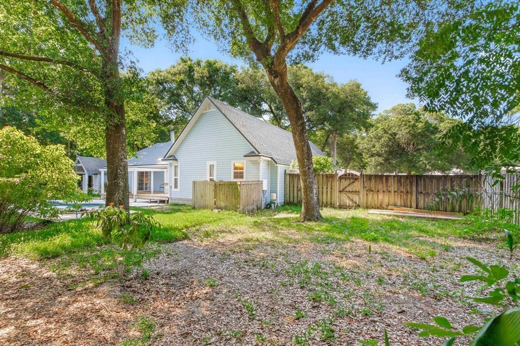 205 Shirley's Way St. Augustine, FL 32086 - Photo 43 of 56 a view of a house with yard and a garden