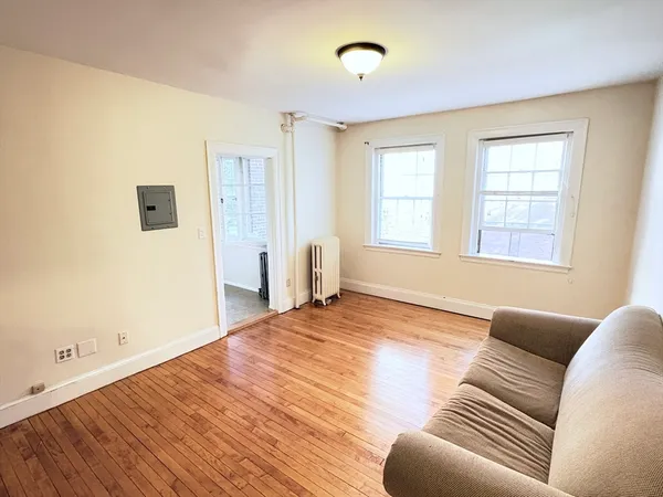 a spacious bedroom with a bed and a couch