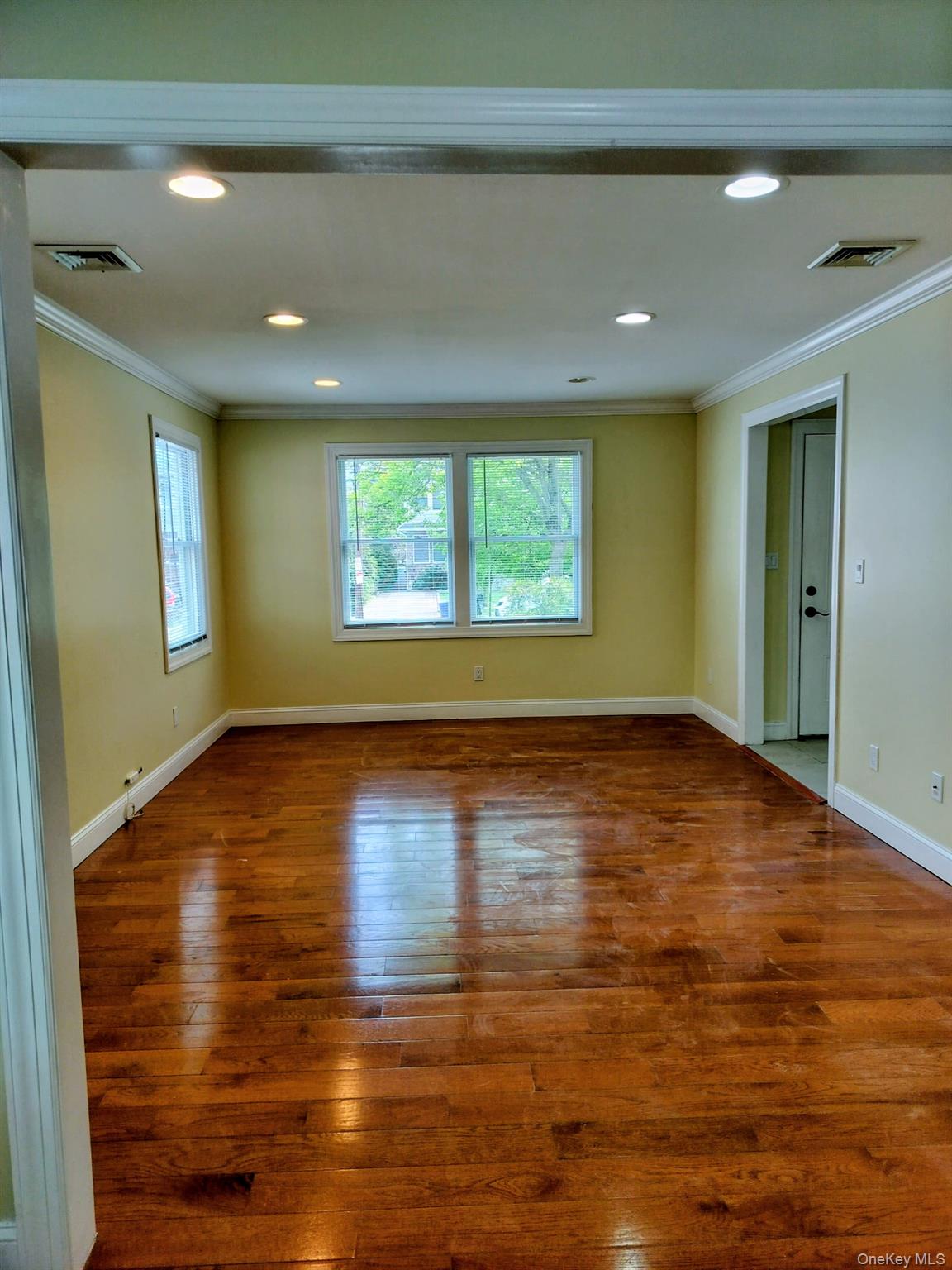 53 Juniper Road, Unit B Port Washington, NY 11050 - Photo 2 of 8 Large living room with recessed lighting throughout