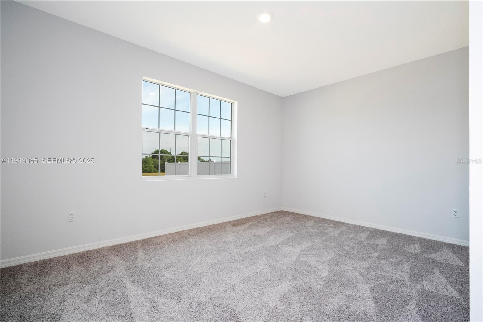 873 Colville Drive, Unit 873 Kissimmee, FL 34759 - Photo 28 of 47 an empty room with windows