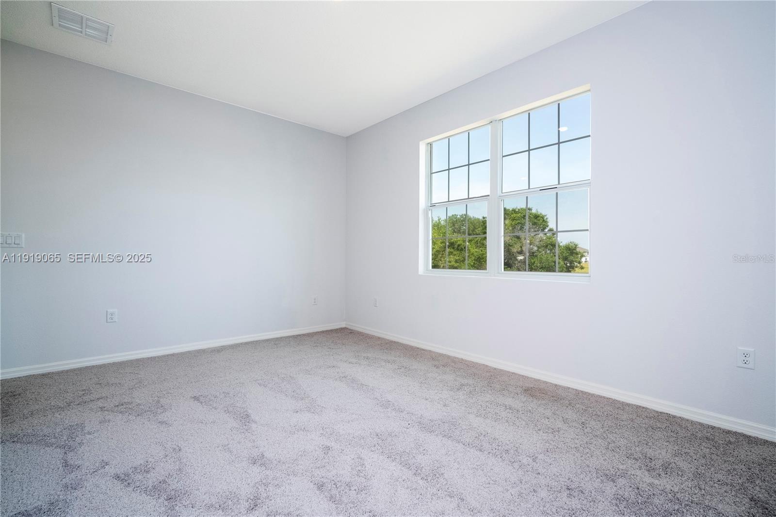 873 Colville Drive, Unit 873 Kissimmee, FL 34759 - Photo 31 of 47 an empty room with windows