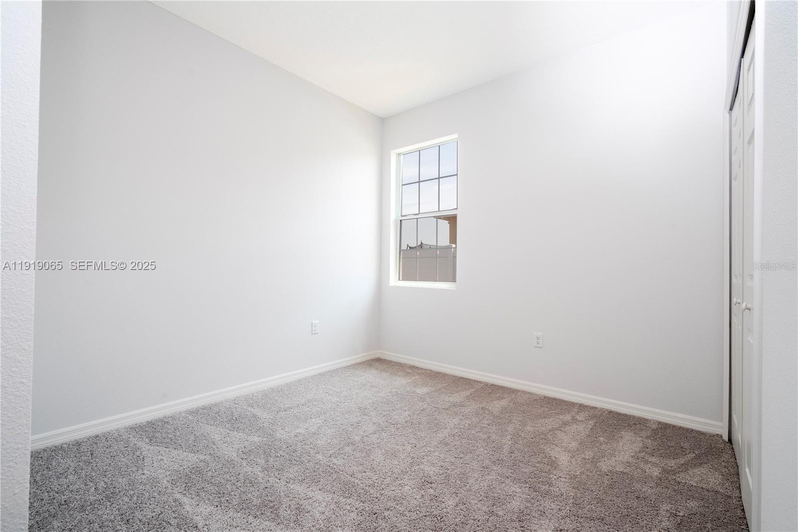 873 Colville Drive, Unit 873 Kissimmee, FL 34759 - Photo 33 of 47 an empty room with windows