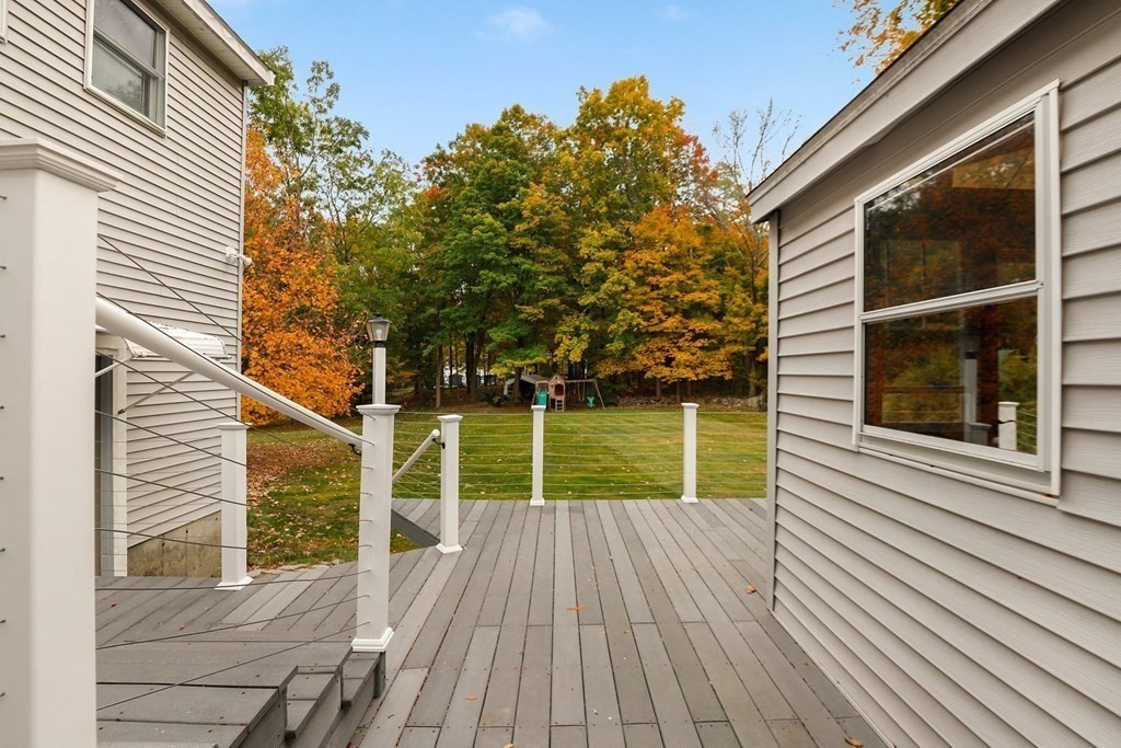 79 Dalton Road Chelmsford, MA 01824 - Photo 36 of 40 a view of deck with a chair and floor