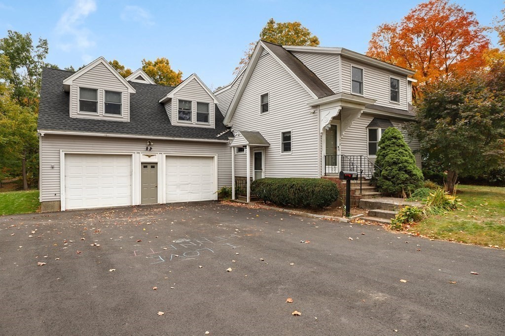 79 Dalton Road Chelmsford, MA 01824 - Photo 39 of 40 a front view of a house with a yard and garage