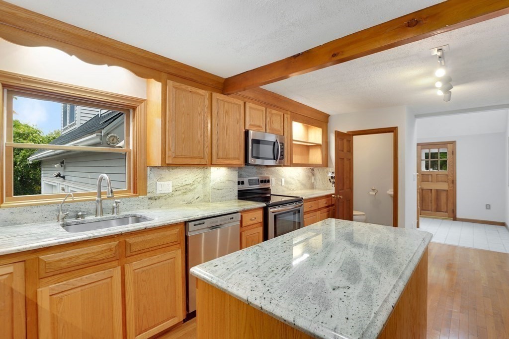 79 Dalton Road Chelmsford, MA 01824 - Photo 4 of 40 a kitchen with stainless steel appliances granite countertop sink stove and refrigerator
