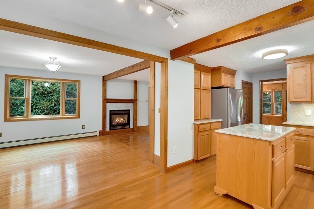 79 Dalton Road Chelmsford, MA 01824 - Photo 6 of 40 a view of a livingroom with a kitchen and a window
