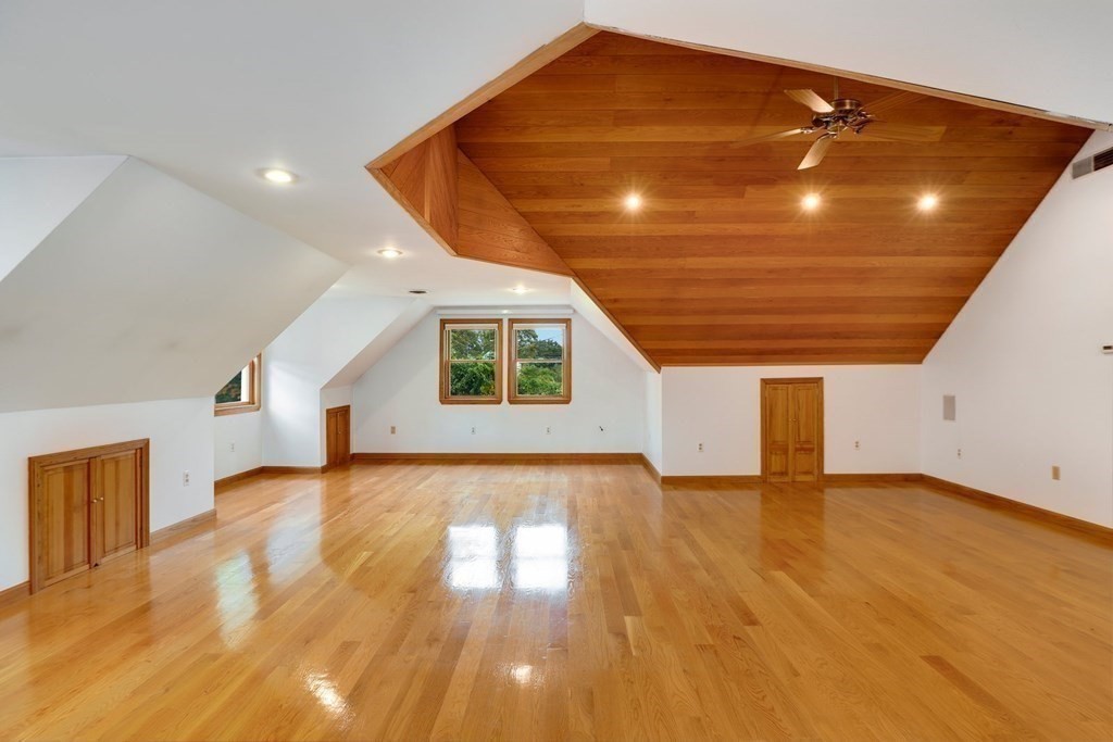 79 Dalton Road Chelmsford, MA 01824 - Photo 7 of 40 a view of an empty room with wooden floor and a window