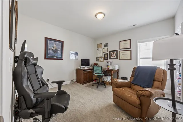 a bedroom with a bed and a desk