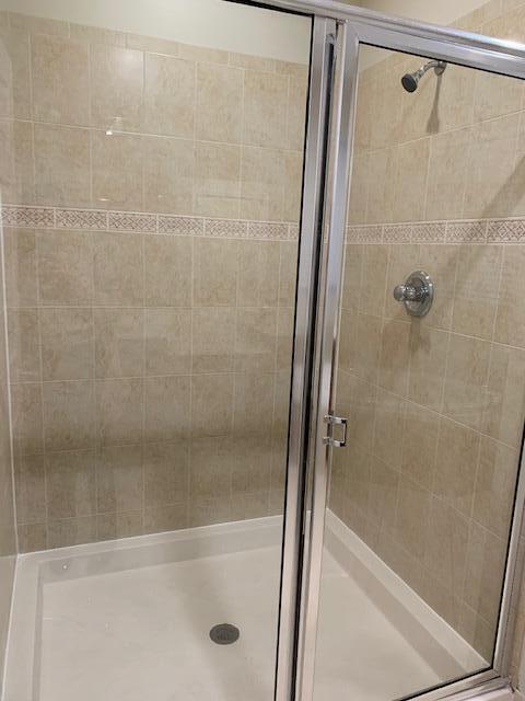 6729 Bulrush Court Greenacres, FL 33413 - Photo 24 of 35 a bathroom with a shower