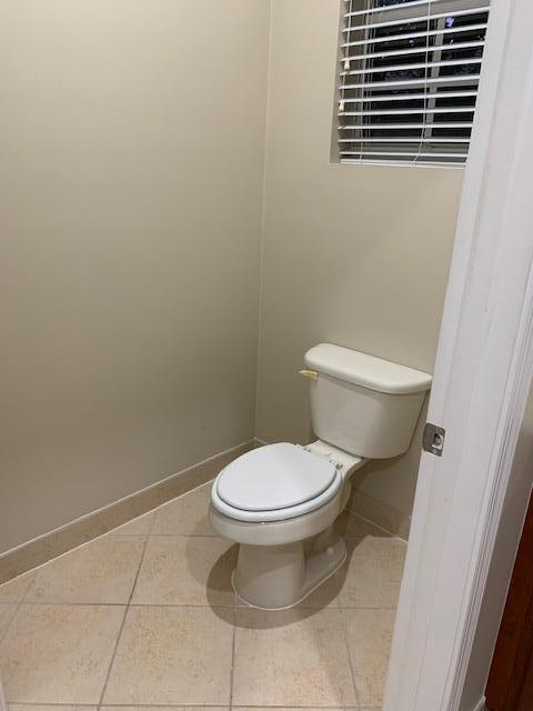 6729 Bulrush Court Greenacres, FL 33413 - Photo 26 of 35 a white toilet sitting next to a small bathroom
