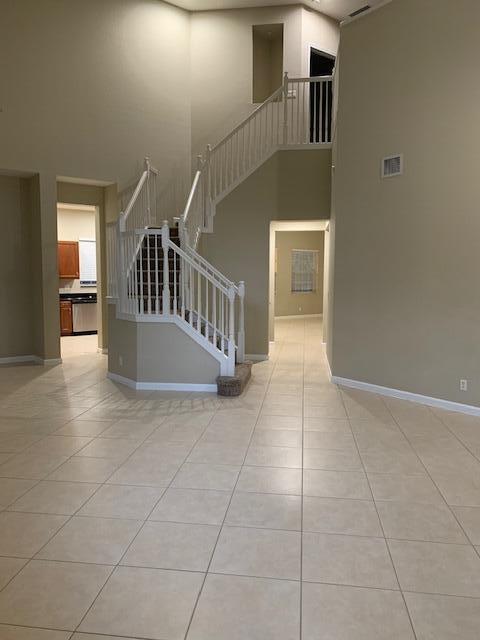 6729 Bulrush Court Greenacres, FL 33413 - Photo 27 of 35 a view of entryway and hall with wooden floor
