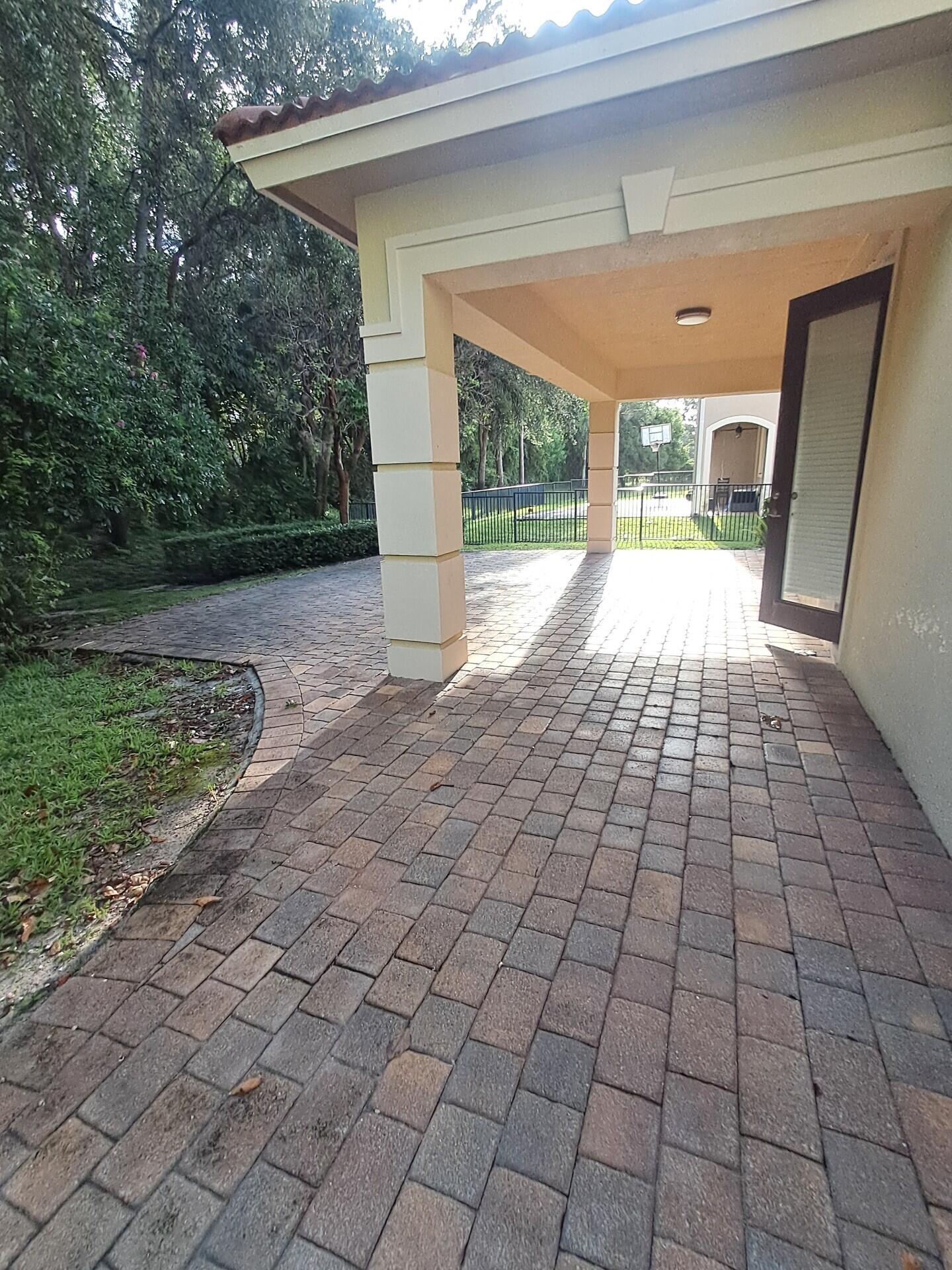 6729 Bulrush Court Greenacres, FL 33413 - Photo 31 of 35 a view of empty room with wooden floor and fan